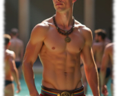 Junger Blondschopf in Regenbogen-Pants. freier Oberkörper, im Wasser stehend. Junger Blondschopf in Regenbogen-Pants. freier Oberkörper, im Wasser stehend.